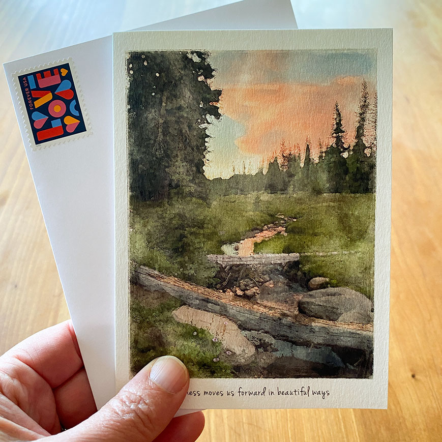 Gratitude card featuring a mountain meadow and stream at sunset.