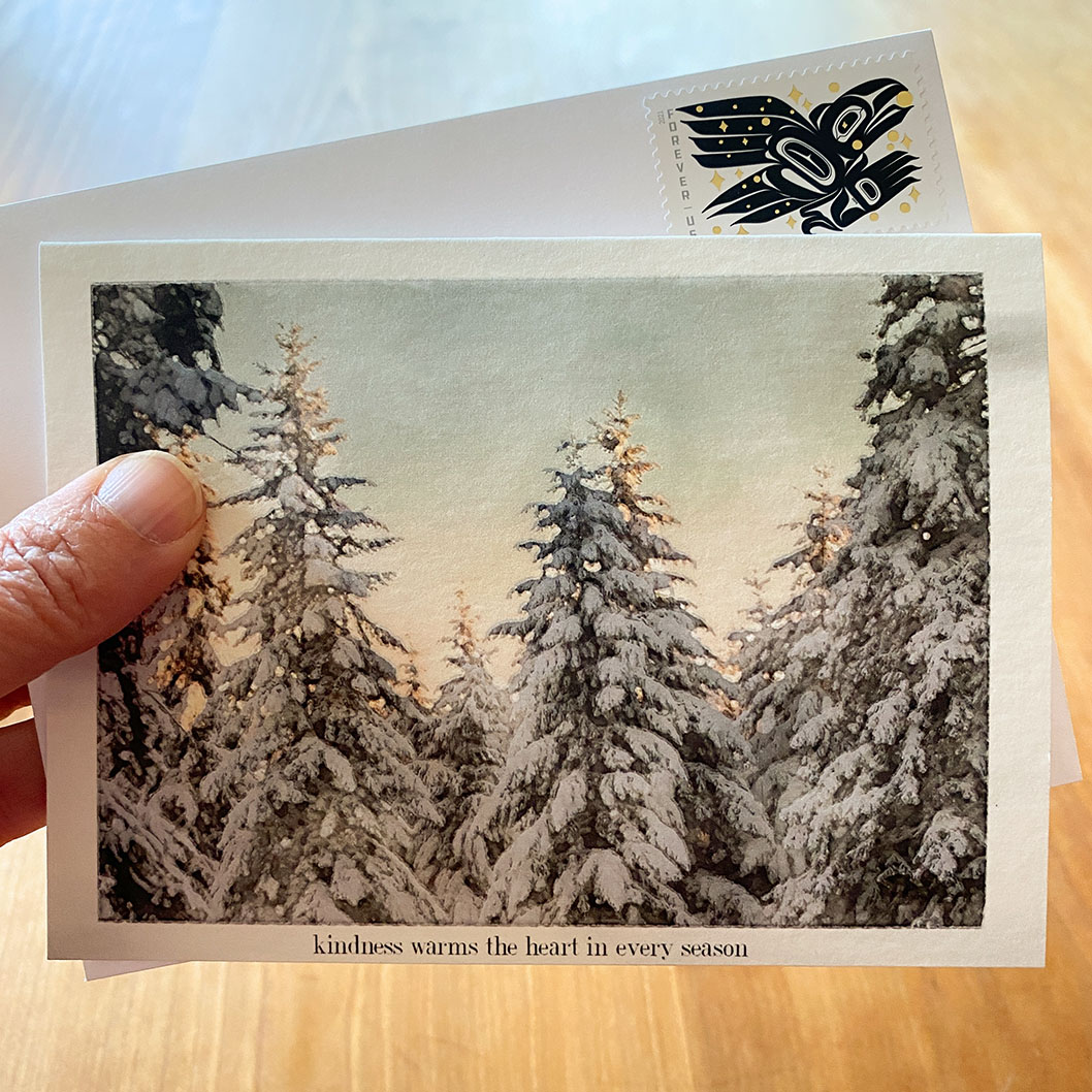 Watercolor of snow on fir trees on gratitude card with Raven Story stamp