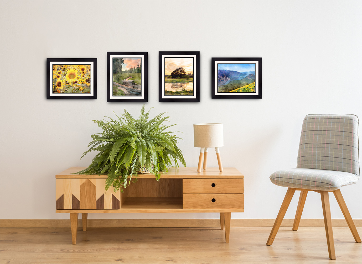 Kindness Roots "Art of Gratitude" Prints of a sunflower and river view are framed and displayed over a desk. 